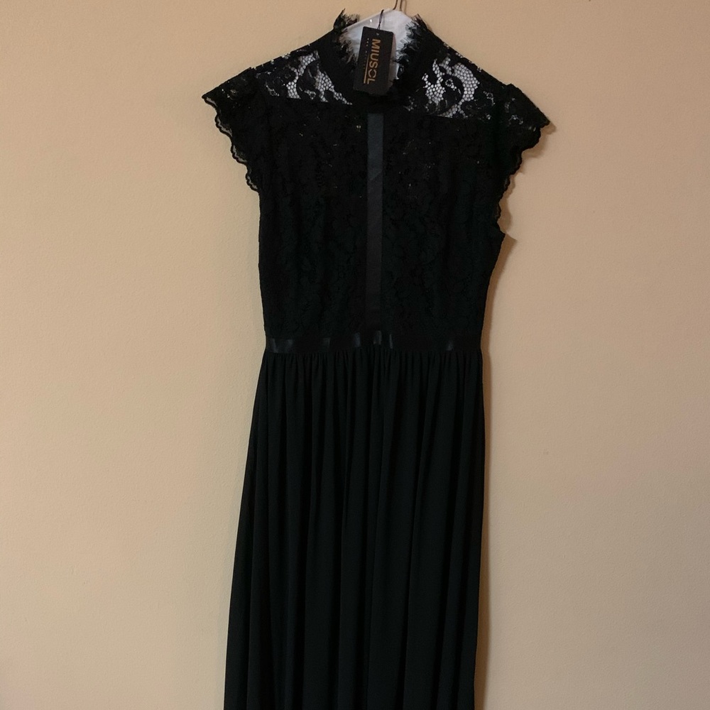 Full length black lace gown.